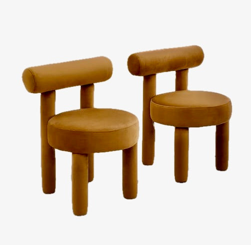 Velvet Curviliniear dining chair:  Curvilinear Dining Chair Amber Velvet Accent Chair Neo-Modern Furniture Pill-Shaped Chair Modern Organic Seating Sculptural Vanity Chair Amber Brown Velvet Minimalist Armless Chair Mid-Century Farmhouse Update High-End Dining Decor Cylindrical Leg Chair Statement Dining Seating 