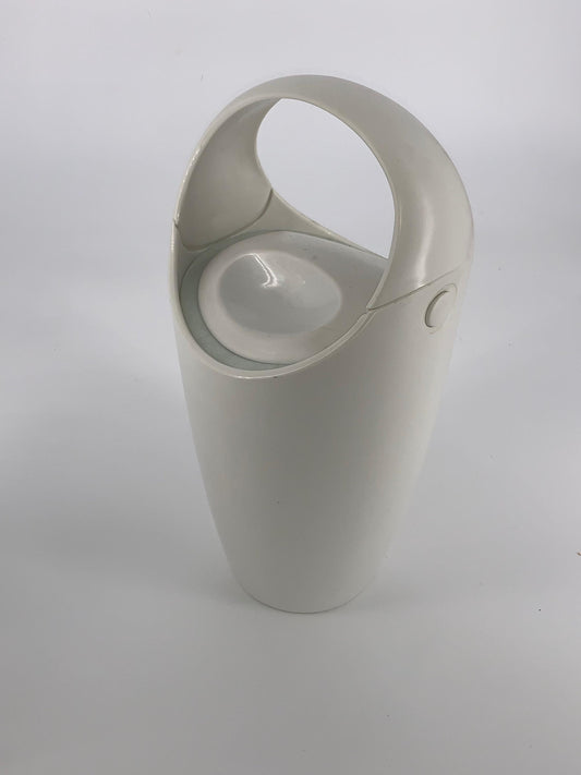 Made from durable white plastic, this insulated container keeps your ice frosty and is a must-have for any mid-century modern enthusiast or cocktail aficionado. In excellent vintage condition, it measures 16" (with handle)and is just perfect for adding a touch of retro cool to your home bar. 